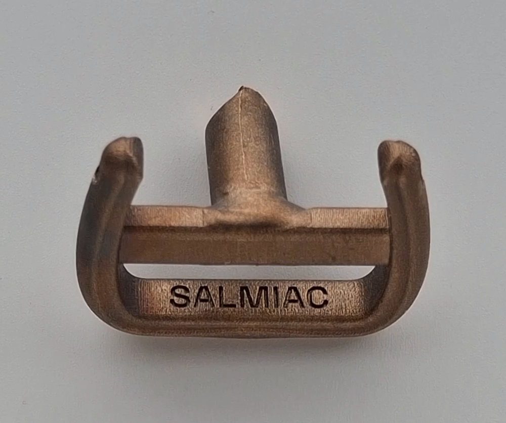 The cast bronze buckle frame with the sprue still attached and SALMIAC on the bar